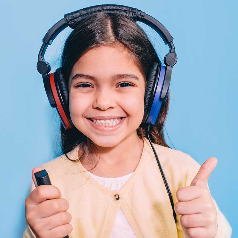Child wearing headphones during hearing screening