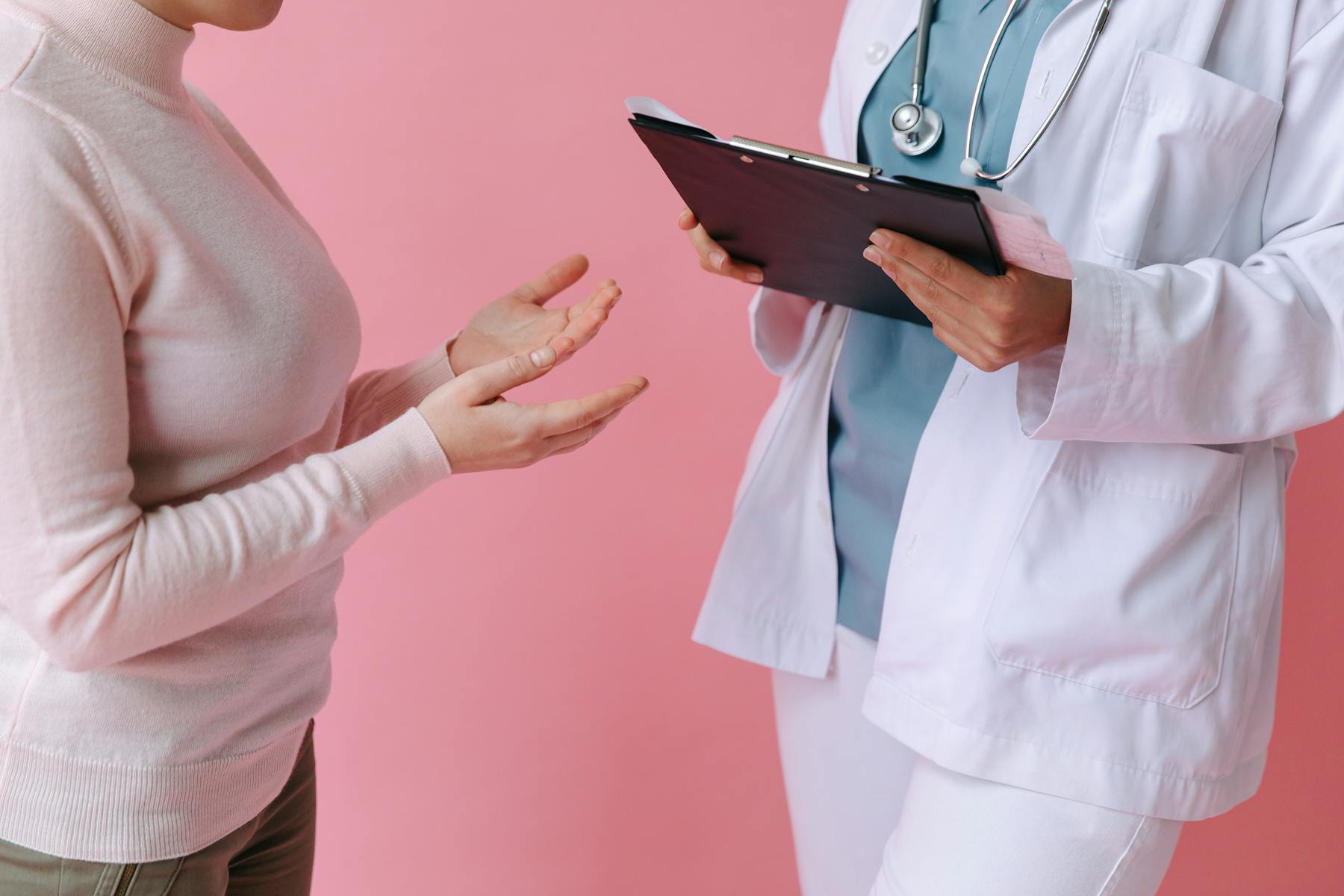 ENT specialist discussing symptoms with a patient